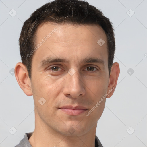 Joyful white adult male with short  brown hair and brown eyes