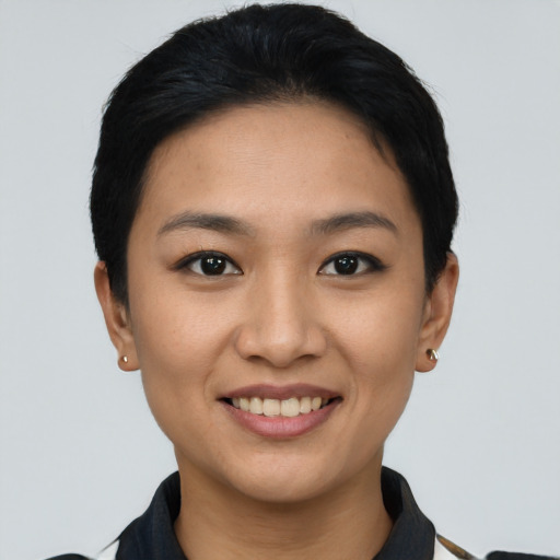 Joyful asian young-adult female with short  black hair and brown eyes