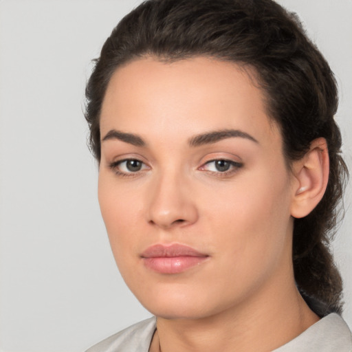 Neutral white young-adult female with medium  brown hair and brown eyes