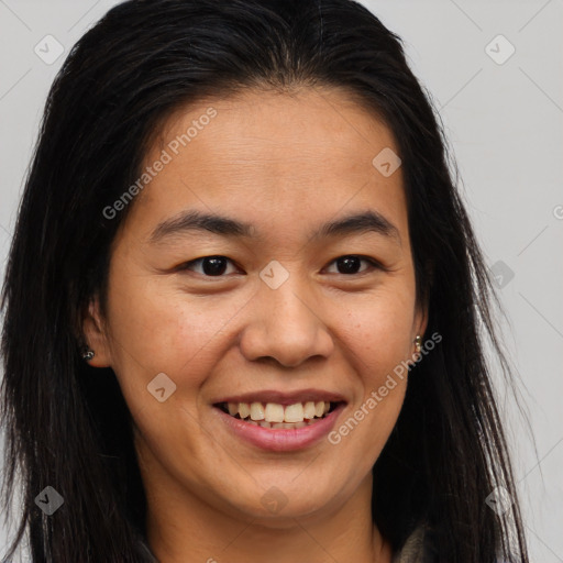 Joyful latino young-adult female with long  brown hair and brown eyes