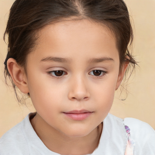 Joyful white child female with short  brown hair and brown eyes