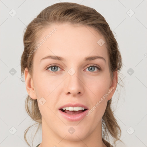 Joyful white young-adult female with medium  brown hair and blue eyes