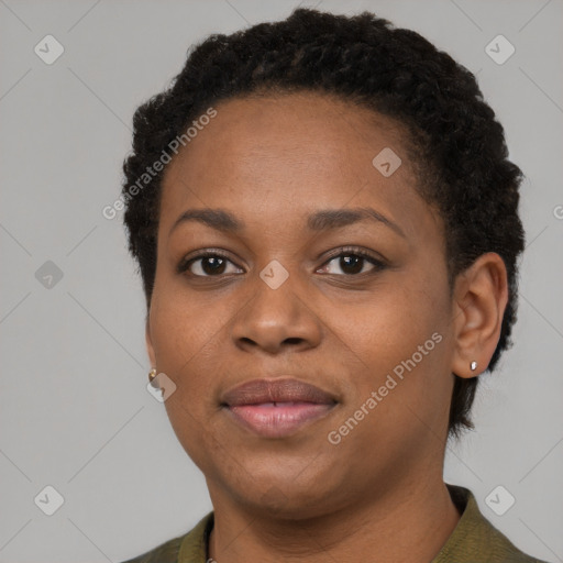 Joyful black young-adult female with short  brown hair and brown eyes