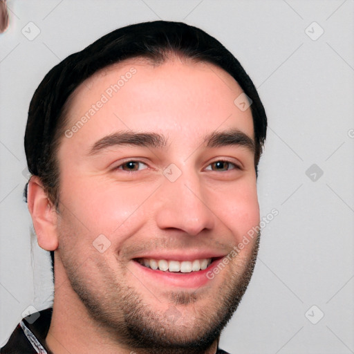 Joyful white young-adult male with short  brown hair and brown eyes