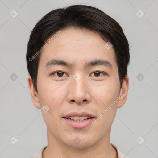 Joyful asian young-adult male with short  brown hair and brown eyes