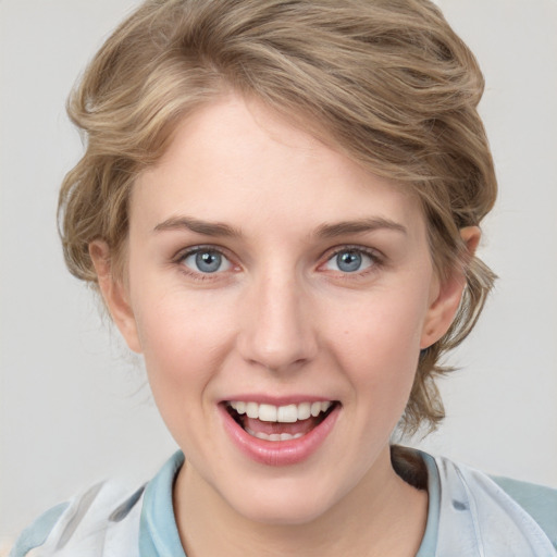 Joyful white young-adult female with medium  brown hair and blue eyes