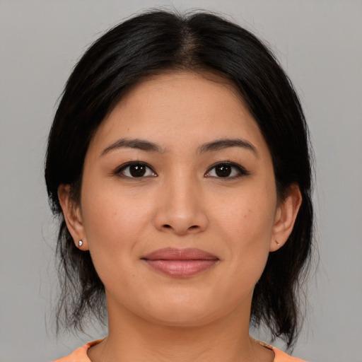 Joyful asian young-adult female with medium  black hair and brown eyes