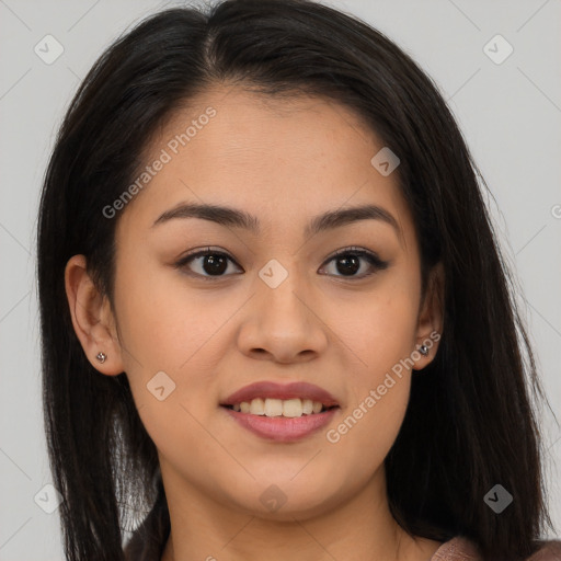 Joyful asian young-adult female with long  brown hair and brown eyes