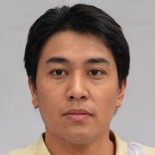 Neutral asian young-adult male with short  brown hair and brown eyes