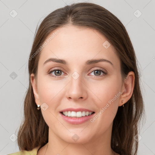 Joyful white young-adult female with medium  brown hair and grey eyes