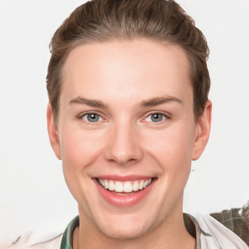 Joyful white young-adult female with short  brown hair and grey eyes