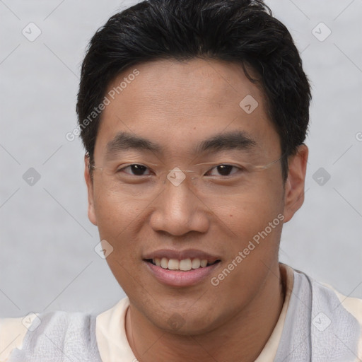 Joyful asian young-adult male with short  brown hair and brown eyes