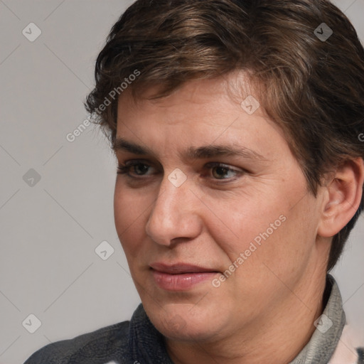 Joyful white adult male with medium  brown hair and brown eyes