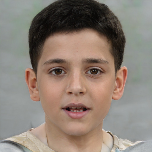 Joyful white child male with short  brown hair and brown eyes