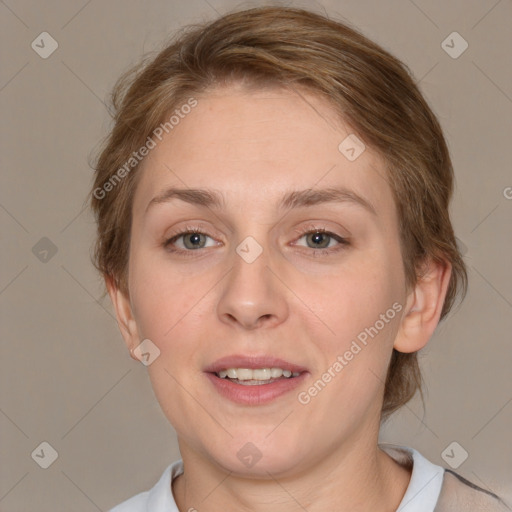 Joyful white adult female with medium  brown hair and grey eyes