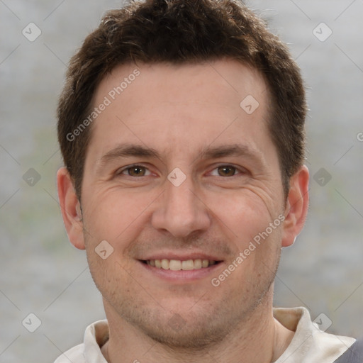 Joyful white adult male with short  brown hair and brown eyes