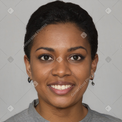 Joyful black young-adult female with short  black hair and brown eyes