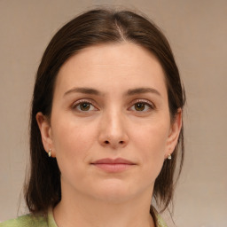 Joyful white young-adult female with medium  brown hair and green eyes