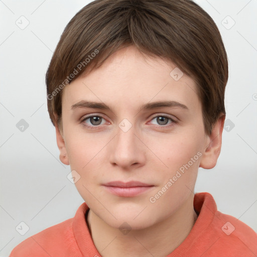 Joyful white young-adult female with short  brown hair and grey eyes