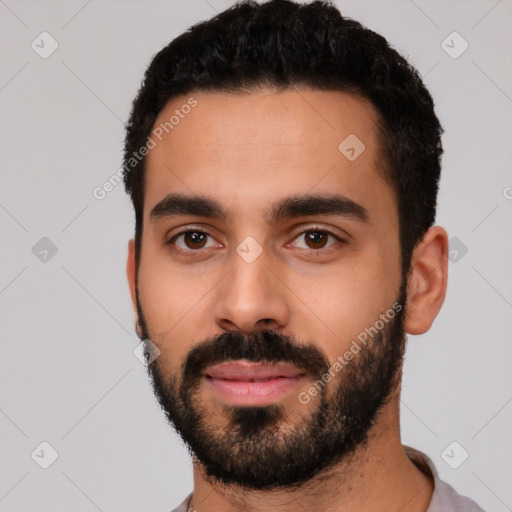 Neutral latino young-adult male with short  black hair and brown eyes