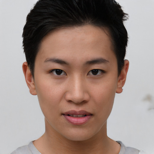 Joyful asian young-adult female with short  brown hair and brown eyes