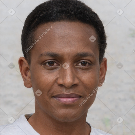 Joyful black young-adult male with short  brown hair and brown eyes