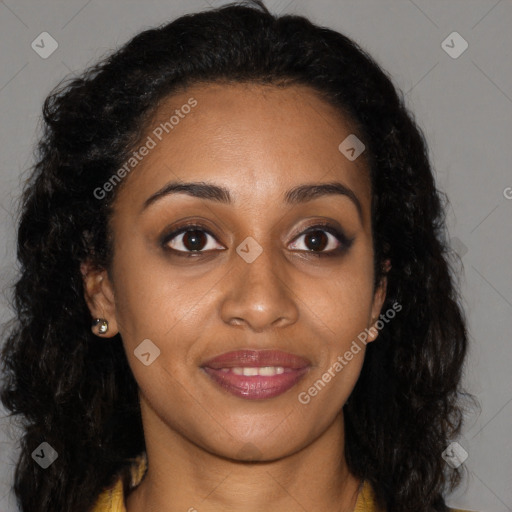 Joyful black young-adult female with long  brown hair and brown eyes