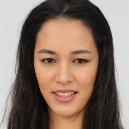 Joyful asian young-adult female with long  brown hair and brown eyes