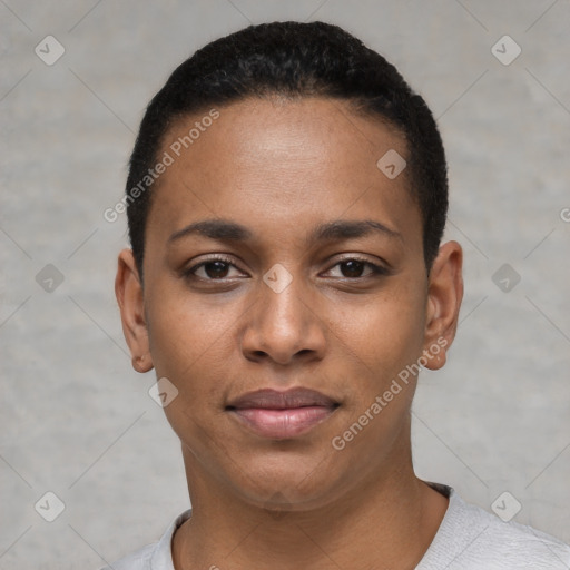 Joyful black young-adult female with short  black hair and brown eyes