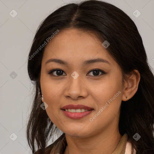 Joyful latino young-adult female with long  brown hair and brown eyes