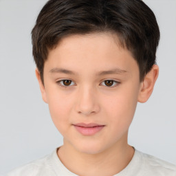 Joyful white child male with short  brown hair and brown eyes