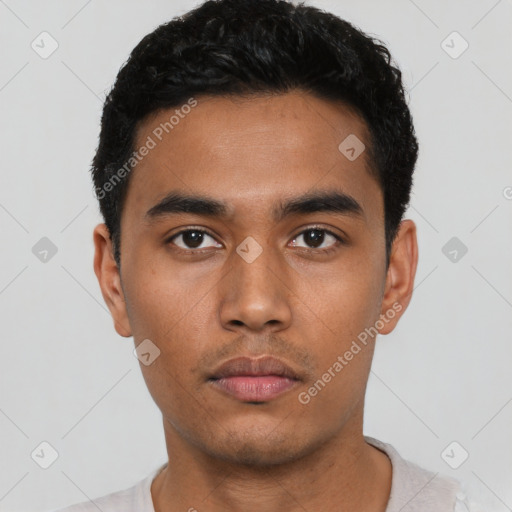 Neutral latino young-adult male with short  black hair and brown eyes