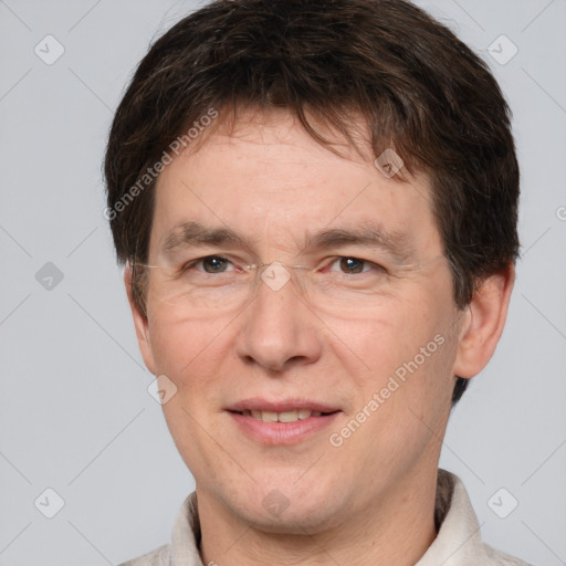 Joyful white adult male with short  brown hair and brown eyes