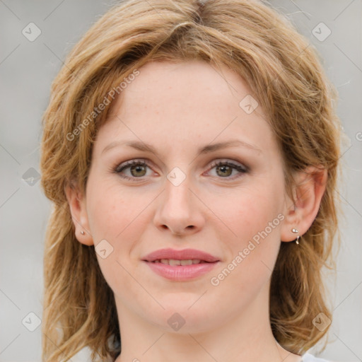 Joyful white young-adult female with medium  brown hair and blue eyes