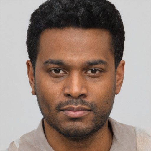 Neutral black young-adult male with short  black hair and brown eyes