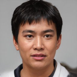 Joyful asian young-adult male with short  brown hair and brown eyes