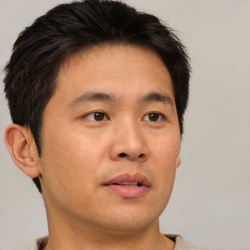 Neutral asian young-adult male with short  brown hair and brown eyes