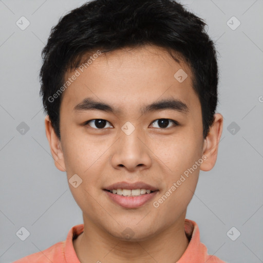 Joyful asian young-adult male with short  brown hair and brown eyes