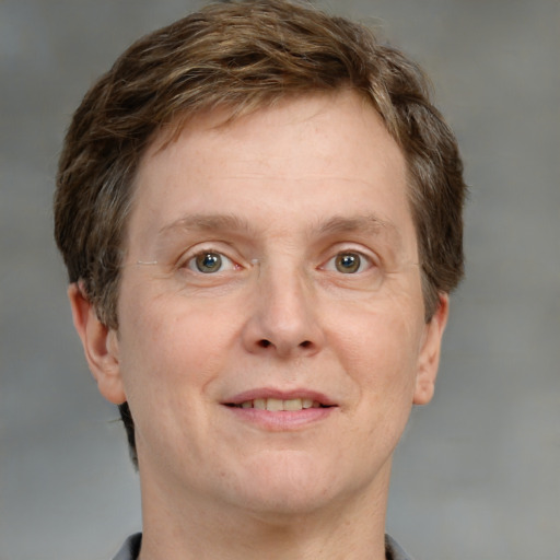 Joyful white adult male with short  brown hair and grey eyes