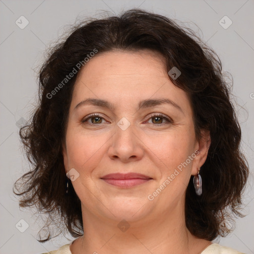 Joyful white adult female with medium  brown hair and brown eyes