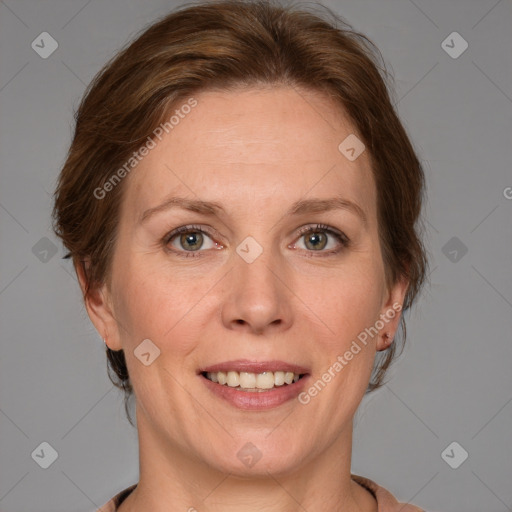 Joyful white adult female with medium  brown hair and grey eyes