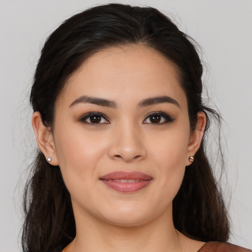 Joyful white young-adult female with long  brown hair and brown eyes