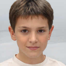 Joyful white child male with short  brown hair and brown eyes