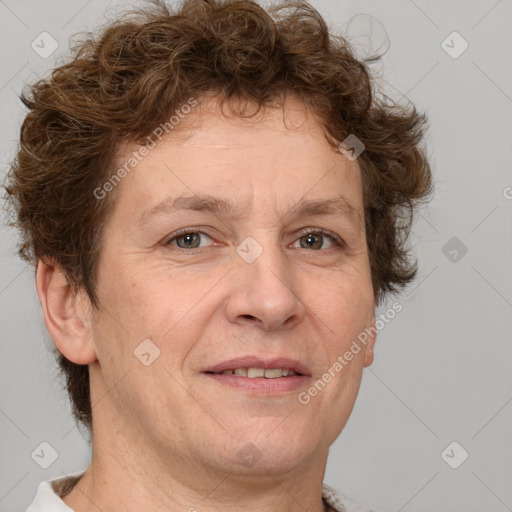 Joyful white adult female with short  brown hair and brown eyes