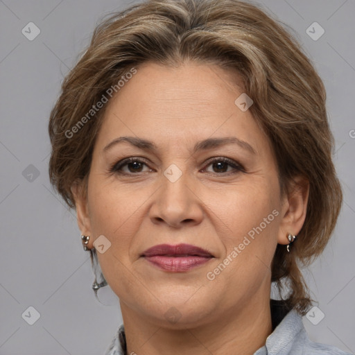 Joyful white adult female with medium  brown hair and brown eyes