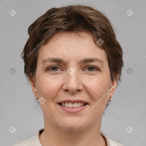 Joyful white adult female with short  brown hair and brown eyes