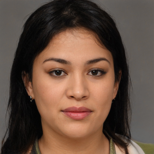 Joyful latino young-adult female with medium  brown hair and brown eyes