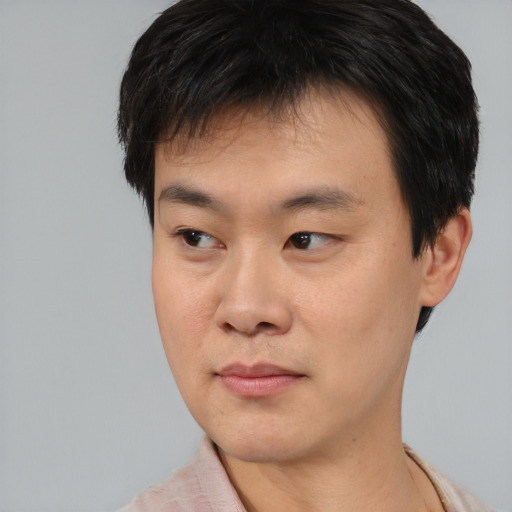 Neutral asian young-adult male with short  black hair and brown eyes