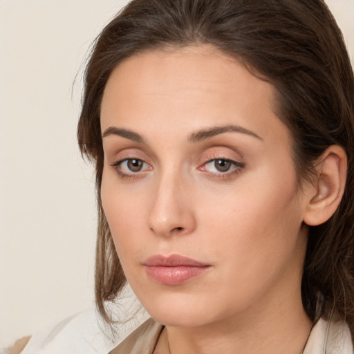 Neutral white young-adult female with medium  brown hair and brown eyes