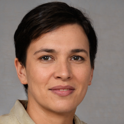 Joyful white adult female with short  brown hair and brown eyes